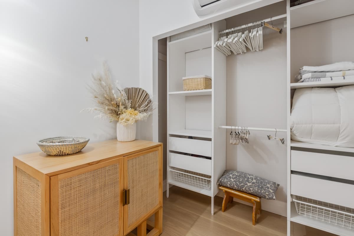 Neatly organized closet with color-coordinated clothing